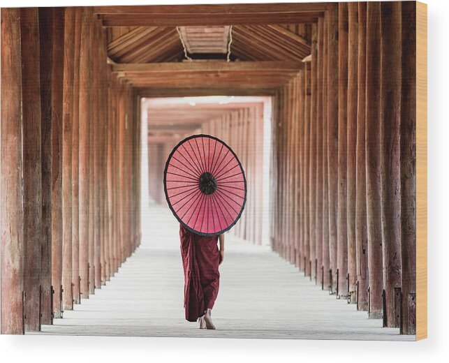 Adolescence Wood Print featuring the photograph Buddhist Monk Walking Along Temple #2 by Martin Puddy
