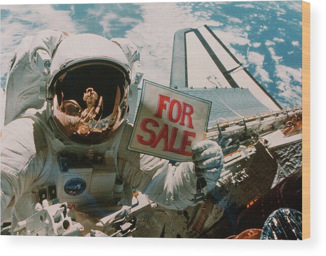 Shuttle Imagery Wood Print featuring the photograph Astronaut Holding 'for Sale' Sign. by Nasa/science Photo Library.