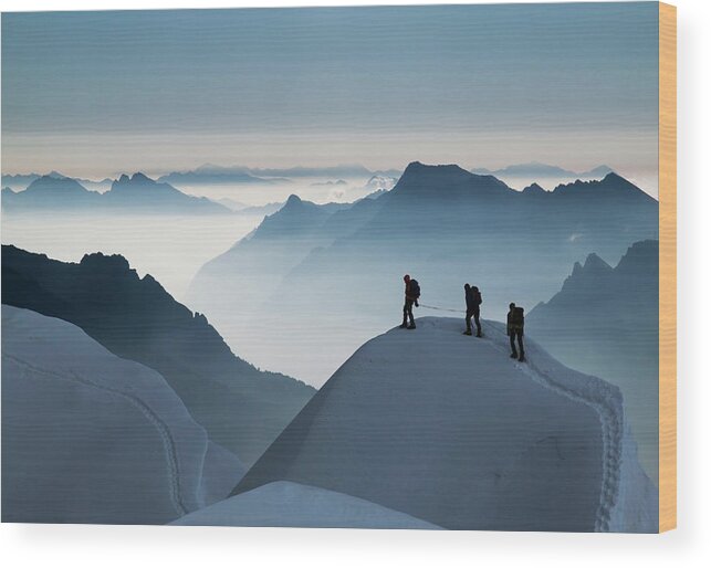 Young Men Wood Print featuring the photograph Climbing Team On A Snowy Ridge by Buena Vista Images