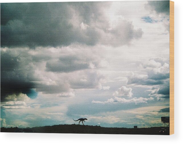 Headed West On Interstate 40 I Caught This Dinosaur In The Foreground Of Western Storm Clouds Of White Wood Print featuring the photograph Dinosaur on the Western Horizon by Belinda Lee