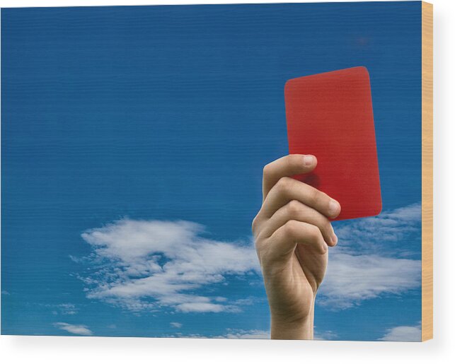 Punishment Wood Print featuring the photograph Hand holding red card against blue sky by Stefano Oppo