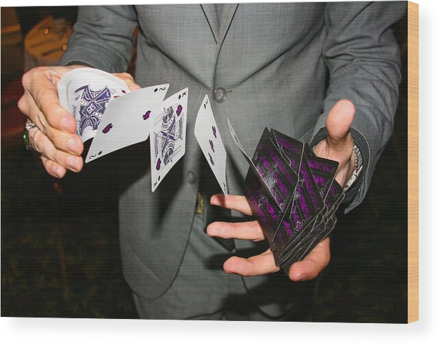 Working Wood Print featuring the photograph Magician illusionist performing card trick by Image by Marie LaFauci