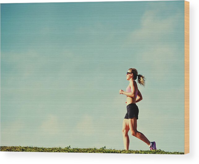 Mature Adult Wood Print featuring the photograph Mature Woman Jogging Outdoors by Anouchka