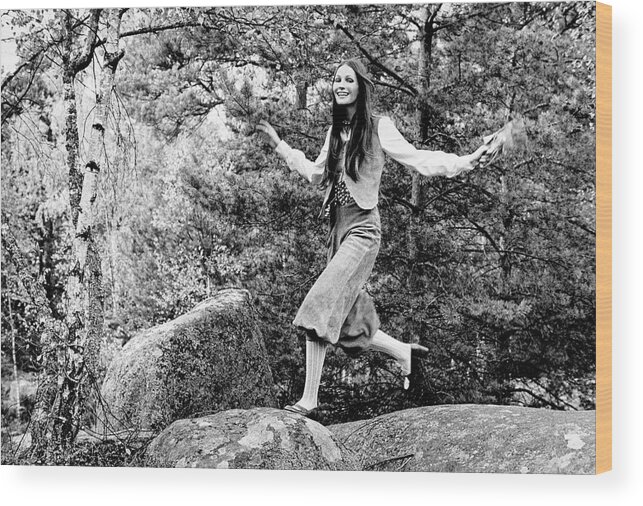 One Person Wood Print featuring the photograph Model Jumps On A Rock Wearing Buckskin Knickers by Henry Clarke