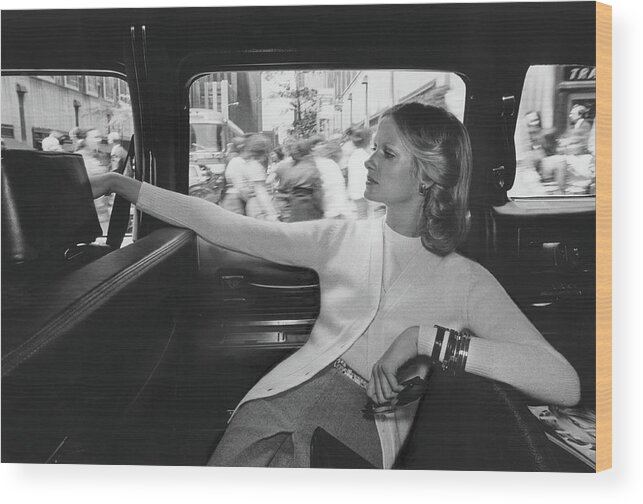 Fashion Wood Print featuring the photograph Model Wearing A It's Pure Gould Cardigan In A Taxi by Kourken Pakchanian
