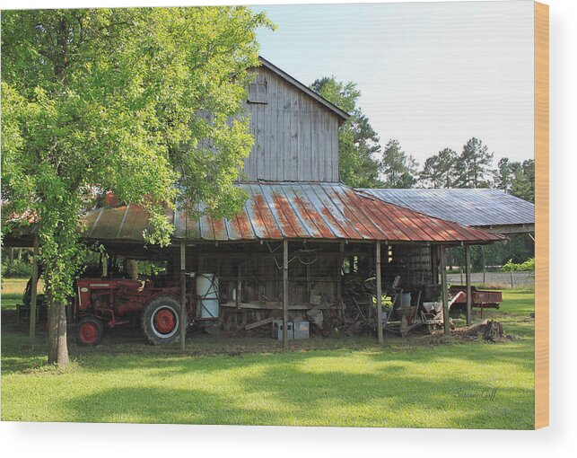 Barn Wood Print featuring the photograph Old Barn with Red Tractor by Suzanne Gaff