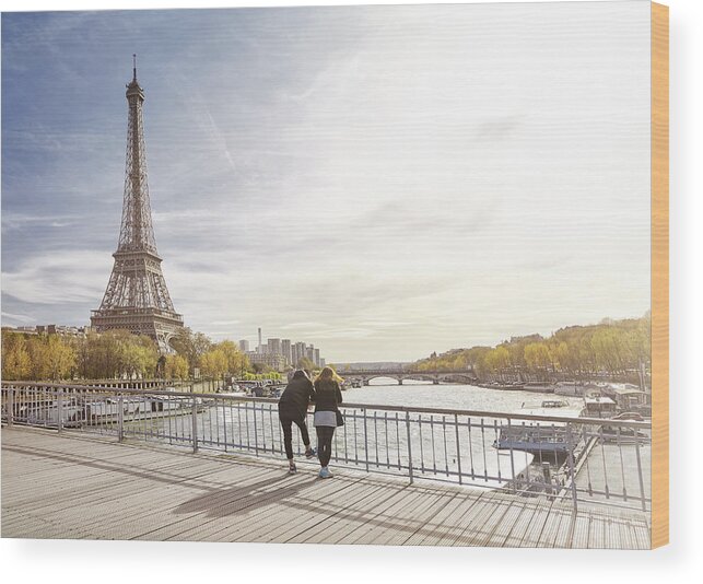 Young Men Wood Print featuring the photograph Tourist couple looking at The Eiffel Tower, Paris, France by James O'Neil