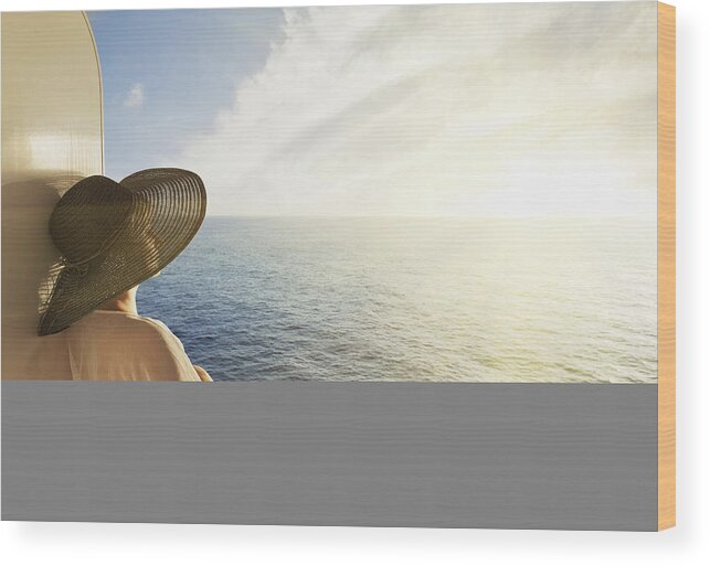 Three Quarter Length Wood Print featuring the photograph Woman looking out to sea on a cruise ship by Buena Vista Images