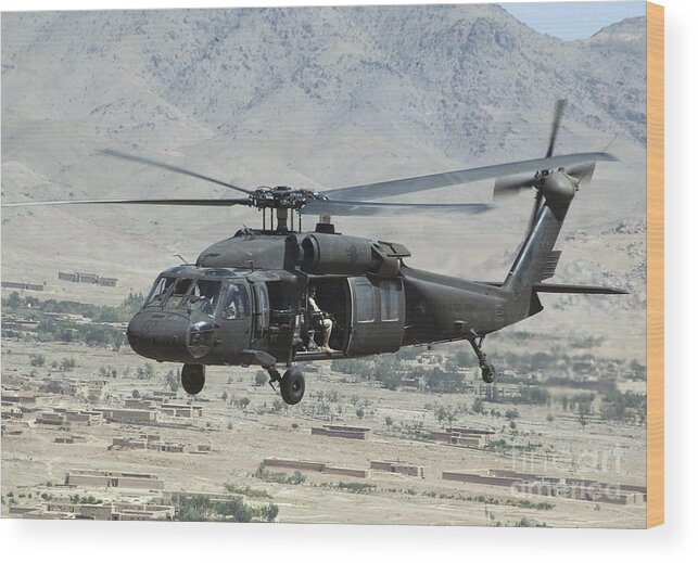 Horizontal Wood Print featuring the photograph A Uh-60 Blackhawk Helicopter by Stocktrek Images