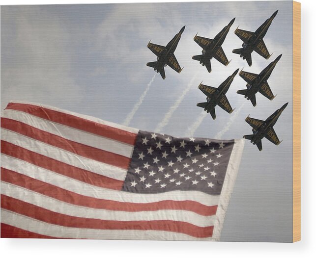 Blue Angels Wood Print featuring the photograph Blue Angels soars over Old Glory as they perform the Delta Formation by Celestial Images