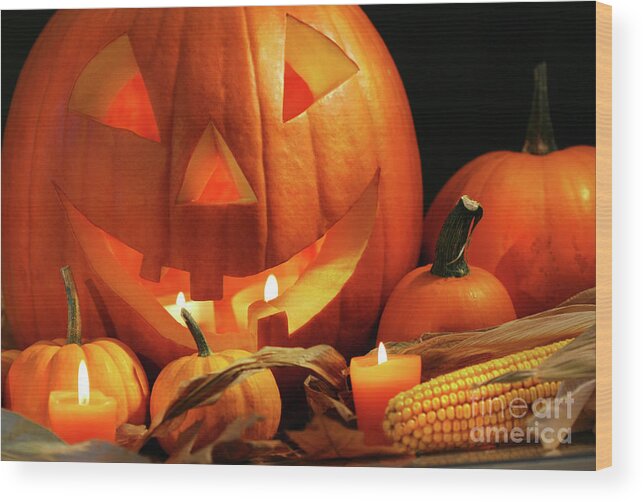 Agriculture Wood Print featuring the photograph Carved pumpkin with candles by Sandra Cunningham