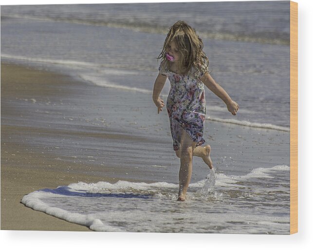 Dancing Wood Print featuring the photograph Dancing in the surf with a pink pacifier by WAZgriffin Digital