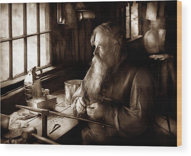 Suburbanscenes Wood Print featuring the photograph Tin Smith - Making toys for Children - Sepia by Mike Savad