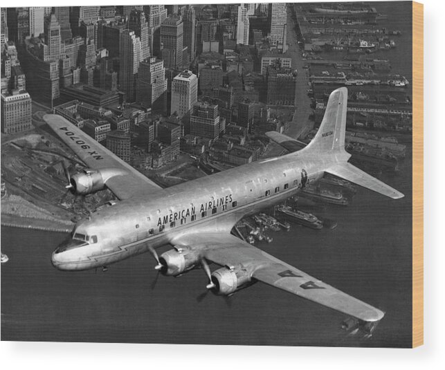 1947 Wood Print featuring the photograph American DC-6 Flying Over NYC #1 by Underwood Archives