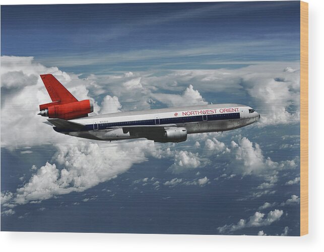 Northwest Orient Airlines Wood Print featuring the mixed media Among the Clouds - Northwest Orient DC-10-40 by Erik Simonsen