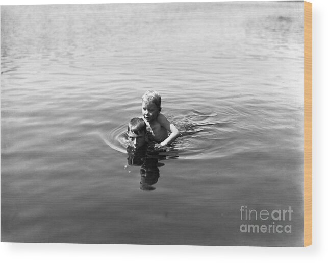 Child Wood Print featuring the photograph Boy Teaching Friend To Swim by Bettmann