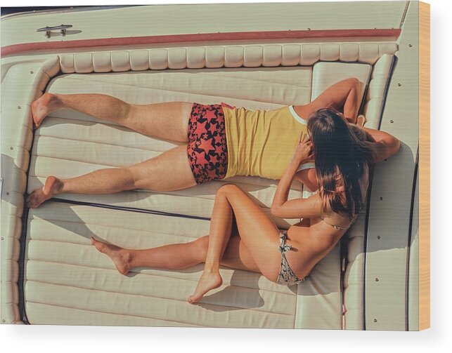 #new2022 Wood Print featuring the photograph Couple Lying Face Down On A Boat by Douglas Mesney