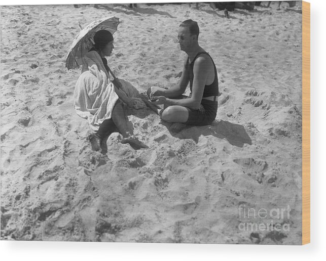 Mid Adult Women Wood Print featuring the photograph Couple Sitting On Beach Palm Beach by Bettmann