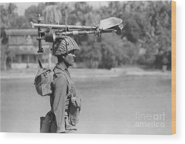 East Wood Print featuring the photograph Indian Soldier Walks, Gear On Head by Bettmann