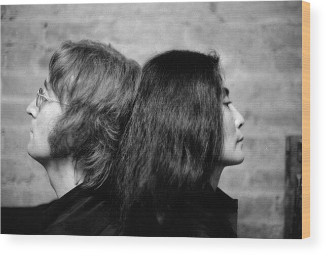 West Village Wood Print featuring the photograph John Lennon And Yoko Ono At Their Bank by New York Daily News Archive