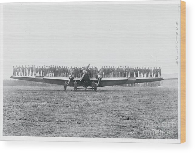 People Wood Print featuring the photograph Men Testing A Planes Wing Rigidity by Bettmann