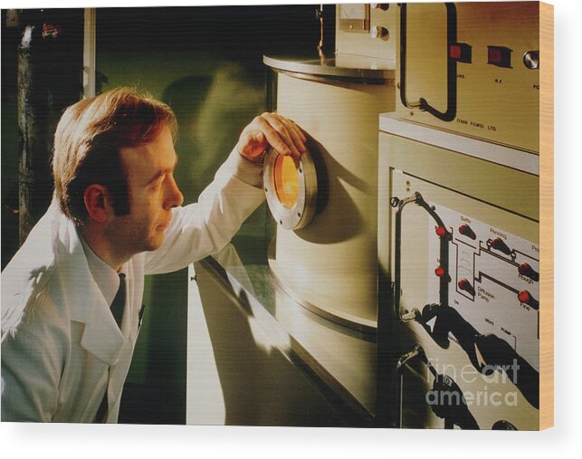 Ion Plating Chamber Wood Print featuring the photograph Technician Views An Ion Plating Chamber by University Of Salford Industrial Centre/a. Sternberg/science Photo Library
