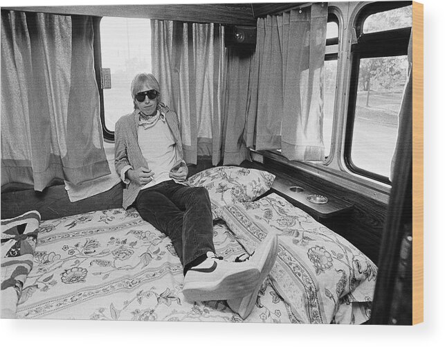 Tom Petty Wood Print featuring the photograph Tom Petty Poses In His Tour Bus by George Rose