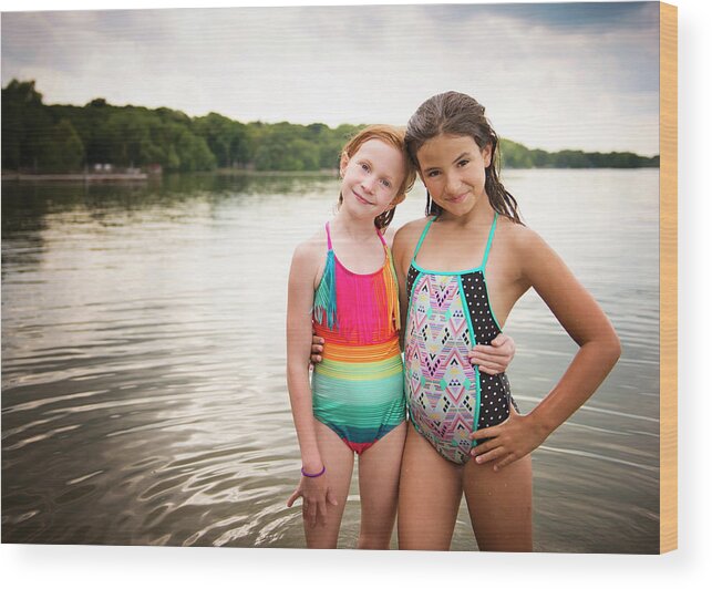 Two Young Girls In Swimsuits Standing By A Lake Wood Print by Cavan Images  - Pixels