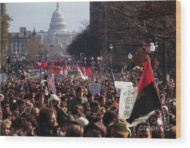 Marching Wood Print featuring the photograph View Of Moratorium Demonstrators by Bettmann