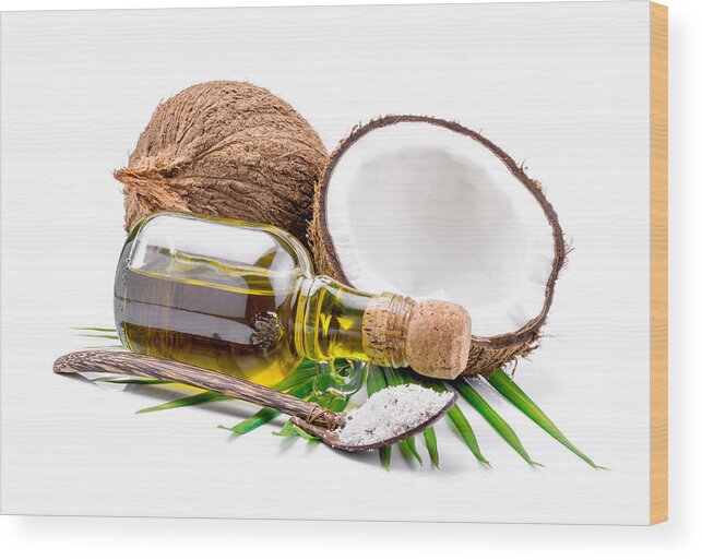 Alternative Medicine Wood Print featuring the photograph Coconut oil for alternative therapy #1 by Aedkais