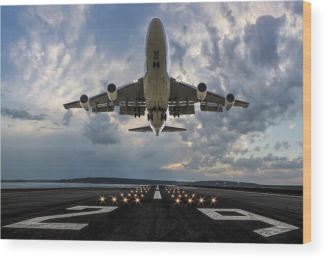 Taking Off Wood Print featuring the photograph Passenger airplane taking off at sunset #3 by Guvendemir