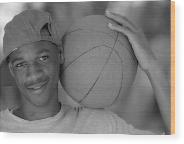 Team Sport Wood Print featuring the photograph Black Teenage Male With Basketball In Black And White by Butch Martin