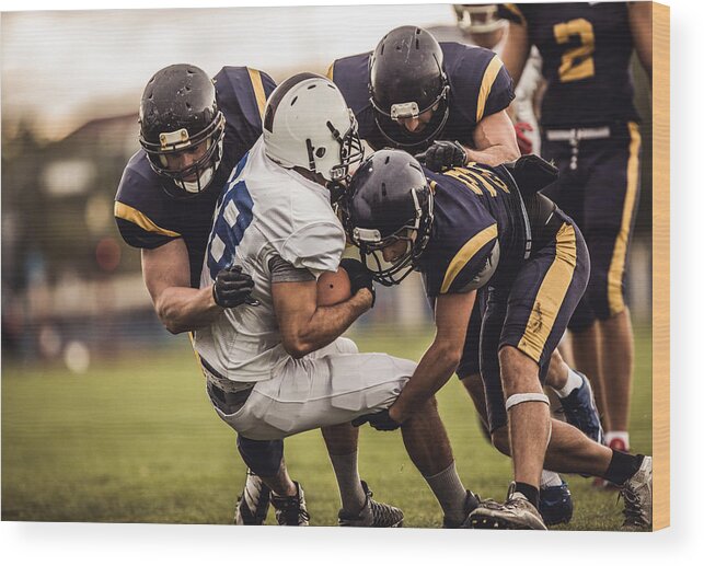 Toughness Wood Print featuring the photograph Blocking an offensive player! by Skynesher