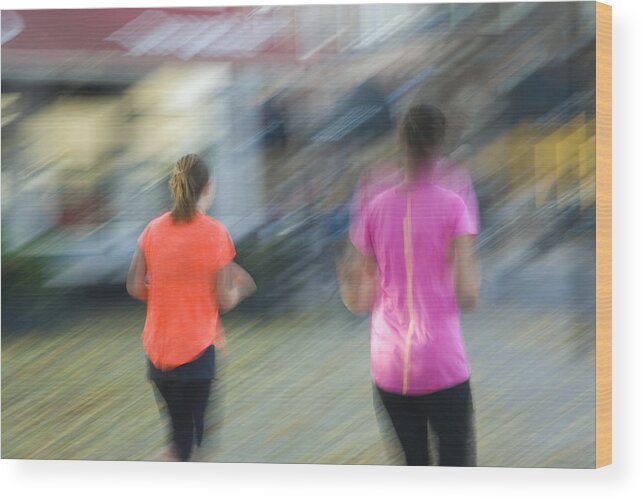 North Holland Wood Print featuring the photograph Blurred image of two female joggers by Lyn Holly Coorg