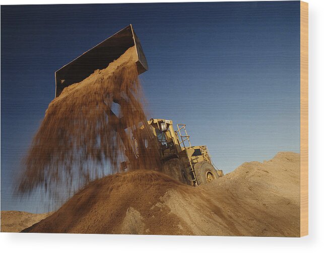 Outdoors Wood Print featuring the photograph Earth mover in quarry dumping sand, low angle view by Justin Pumfrey