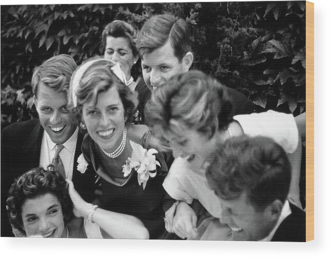 President Kennedy Wood Print featuring the photograph Kennedy Family Embracing John and Jackie At Wedding - 1953 by War Is Hell Store