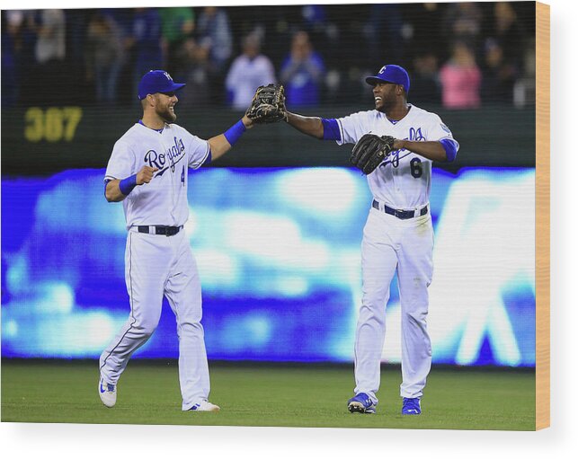 American League Baseball Wood Print featuring the photograph Lorenzo Cain and Alex Gordon by Jamie Squire