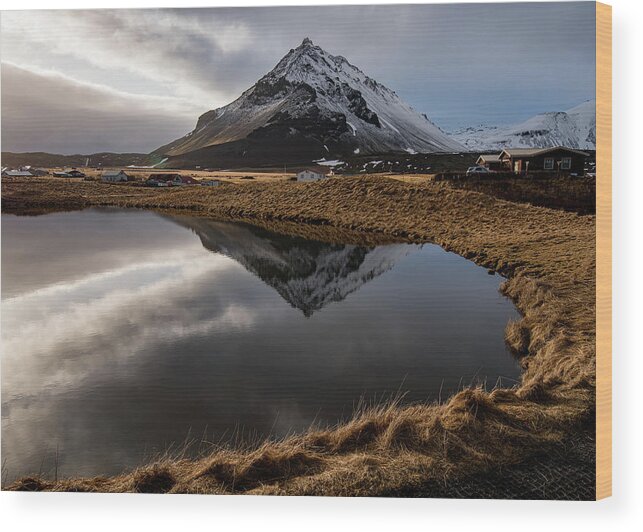 Arnarstapi Wood Print featuring the photograph Mountain landscape at and hilltop reflection at a lake. by Michalakis Ppalis