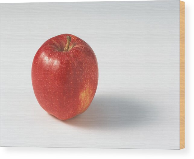 White Background Wood Print featuring the photograph Red apple by Isabelle Rozenbaum