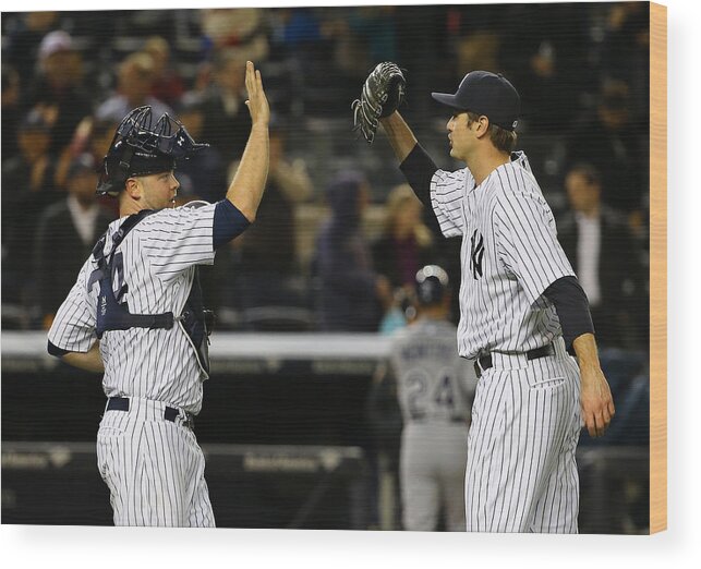 Brian Mccann Wood Print featuring the photograph Tampa Bay Rays v New York Yankees by Al Bello