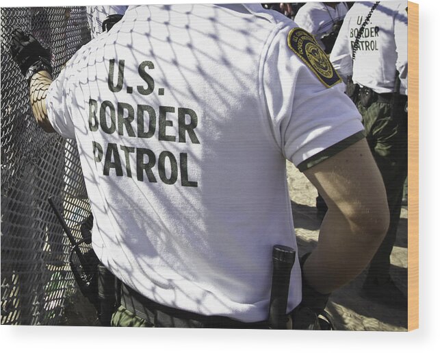 People Wood Print featuring the photograph The Back of a United States Border Patrol Agent by VallarieE