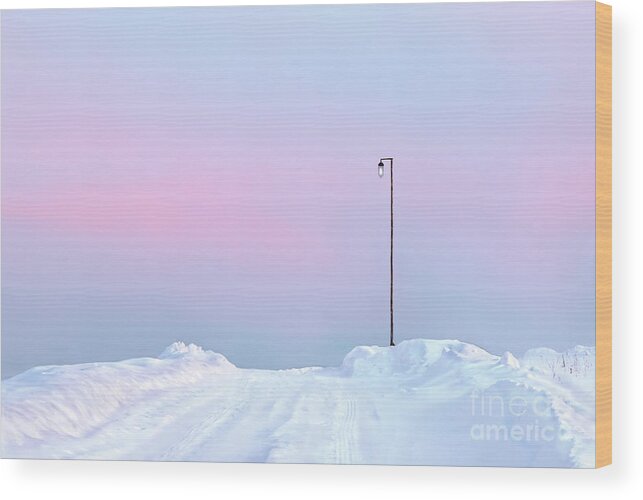 Winter Sunset Pastel Shades Russia Snow Snowdrift Road Pink Post Snowdrifts Blue Sky Impression Impressionistic Conceptual Expressive Creative Contemporary Atmospheric Minimalistic Minimalist Dusk Calm Serene Tranquil Tranquillity Charming Aesthetic Artistic Stylish Style Single Lonely Loneliness Alone Solo Solitary Beautiful Stunning Magnificent Landscape Mindfulness Serenity Inspirational Magic Poetic Singular Powerful Delightful Appealing Simplicity Delicate Gentle Evocative Simple Watercolor Wood Print featuring the photograph Winter sunset in pastel shades A lamp post on snowy road with sunset reflections on snow by Tatiana Bogracheva