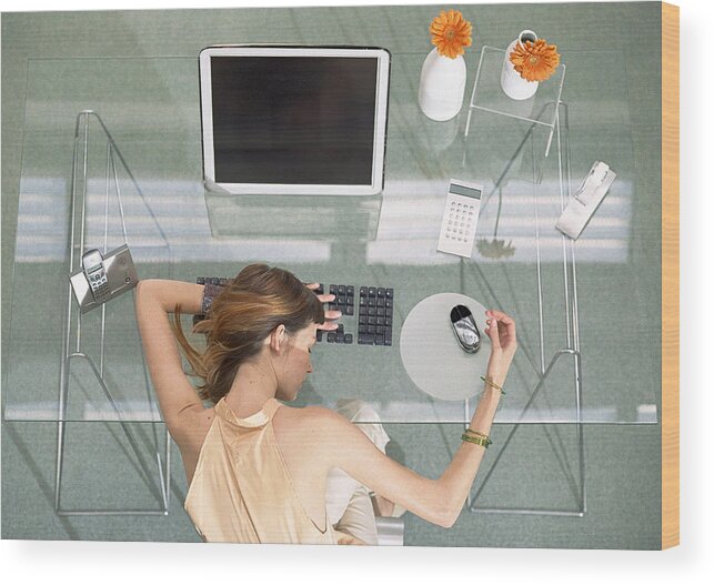 Corporate Business Wood Print featuring the photograph Woman leaning head on desk with futuristic devices, high angle view by Coco Marlet