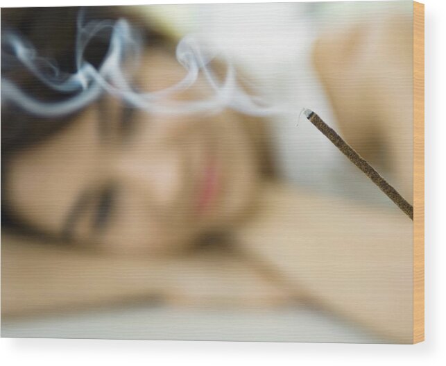 Tranquility Wood Print featuring the photograph Woman watching incense burn by ZenShui/Michele Constantini