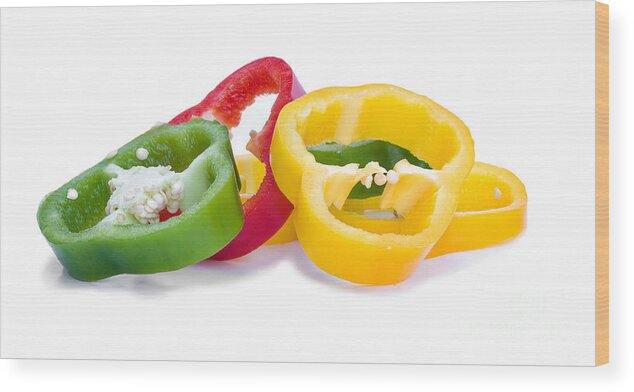 Bulbous Wood Print featuring the photograph Sliced Colorful Peppers by Meirion Matthias
