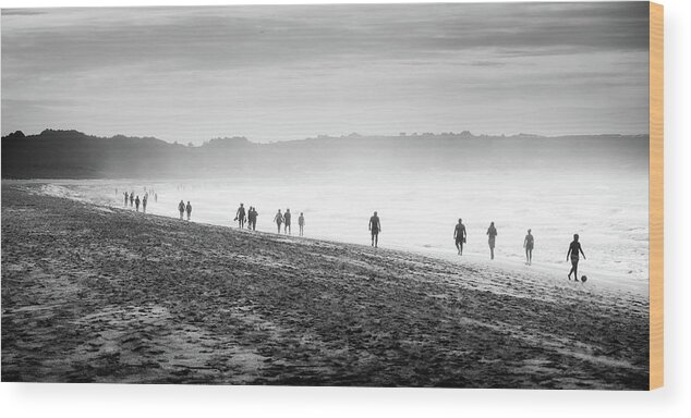 Water's Edge Wood Print featuring the photograph People Walking On The Beach by Ramón Espelt Photography