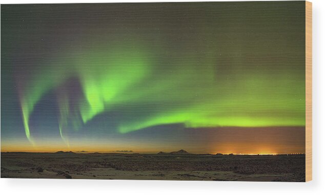 Iceland Wood Print featuring the photograph Aurora above Keflavik in Iceland. by Andy Astbury