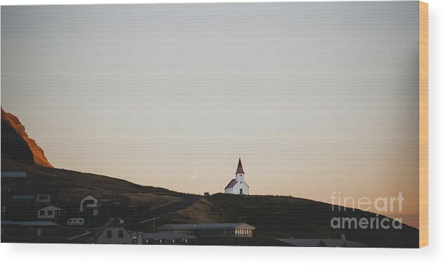 Architecture Wood Print featuring the photograph Church on top of a hill and under a mountain, with the moon in the background. by Joaquin Corbalan