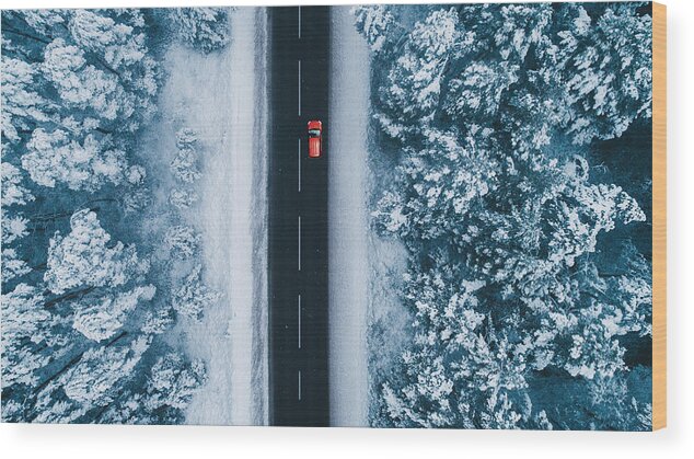 Tranquility Wood Print featuring the photograph Aerial view of road in winter with red car on it by Oleh_Slobodeniuk
