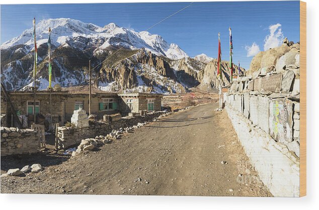 Ancient Wood Print featuring the photograph On the Annapurna circuit trekking near Manang in Nepal by Didier Marti